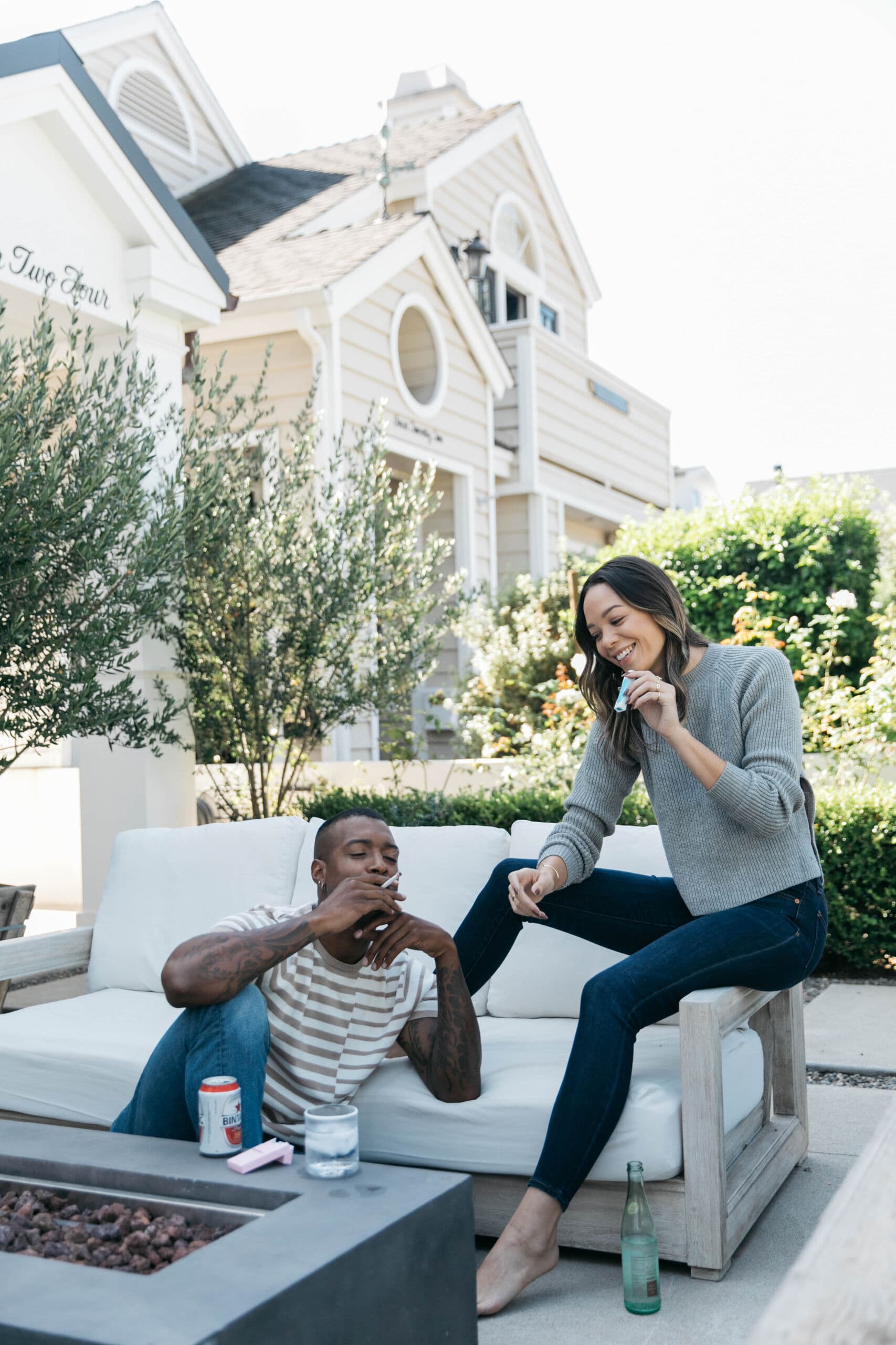 Couple laughing together on a patio with PHILTER